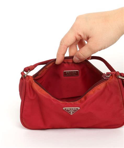 squeeze open prada red pouch